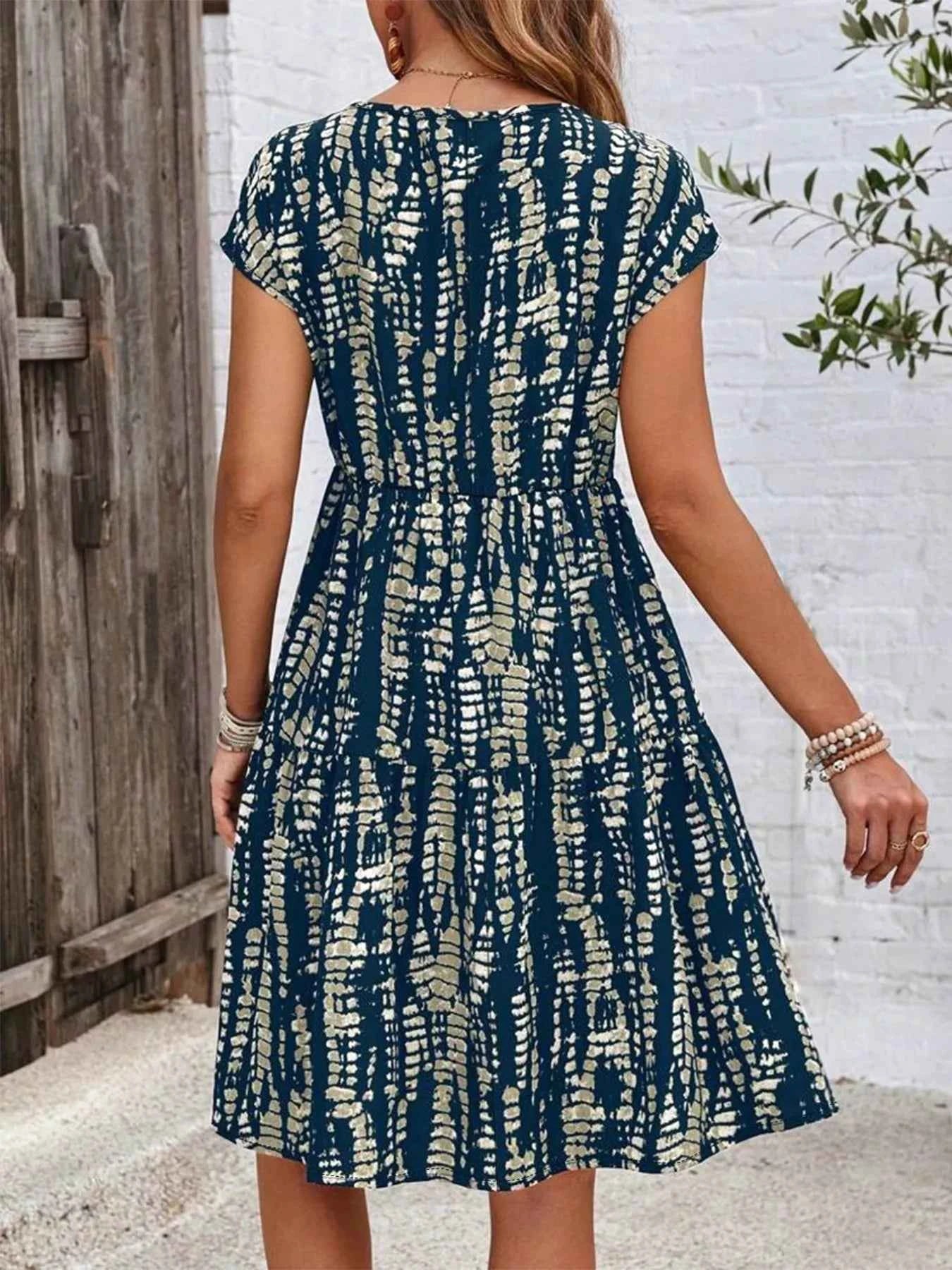Plus Size Printed Long Sleeve Ruffle Hem Mini Dress